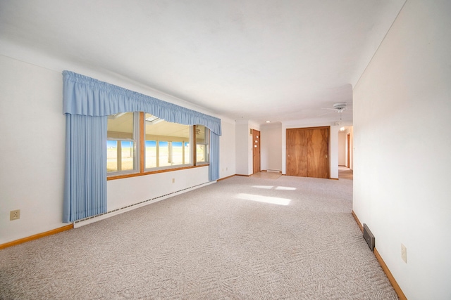 unfurnished room with carpet and ceiling fan