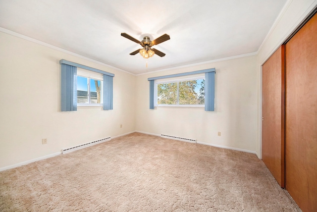 unfurnished bedroom with carpet flooring, ceiling fan, ornamental molding, and baseboard heating