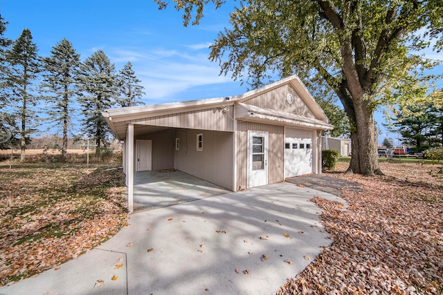 garage featuring a carport