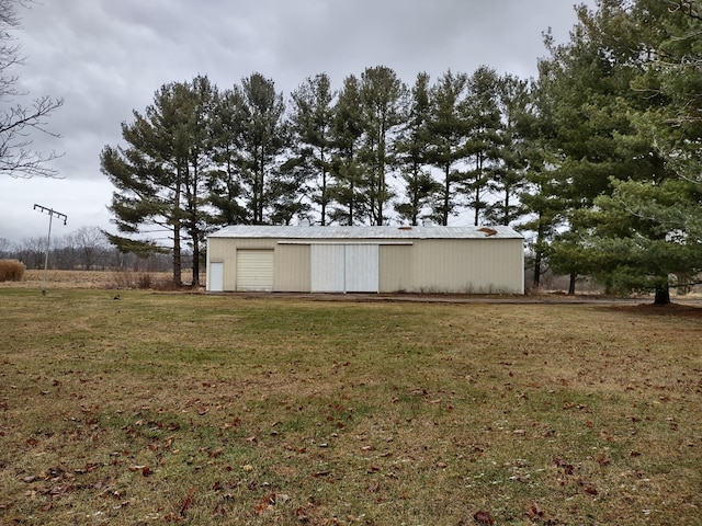 view of outbuilding featuring a lawn