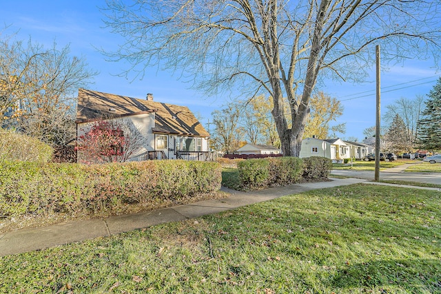 view of home's exterior with a lawn