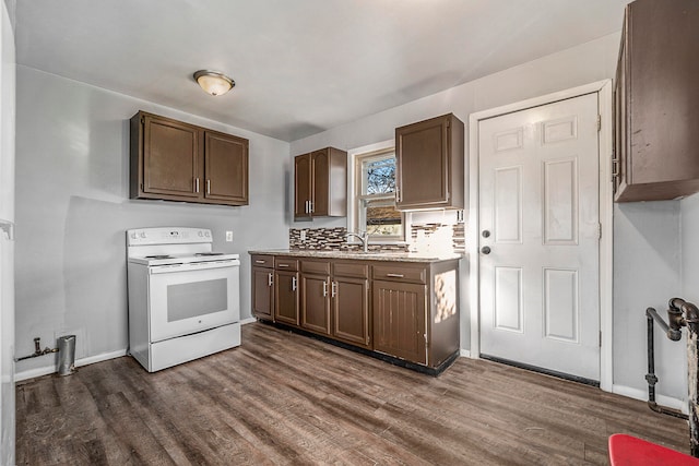 kitchen with dark brown cabinets, dark hardwood / wood-style flooring, white electric range, and sink