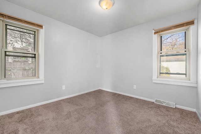 unfurnished room with carpet floors