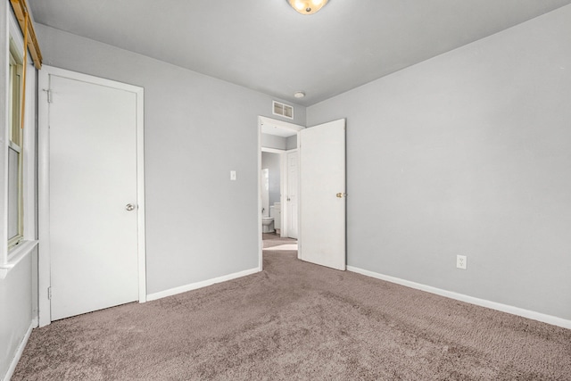 unfurnished bedroom with carpet floors