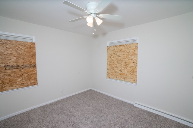 spare room featuring ceiling fan, carpet floors, and a baseboard radiator