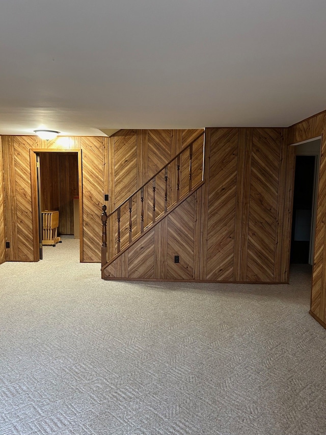 2369 E Golden Shores Dr, Fenton, MI 48430 - stairway featuring carpet flooring and wooden walls
