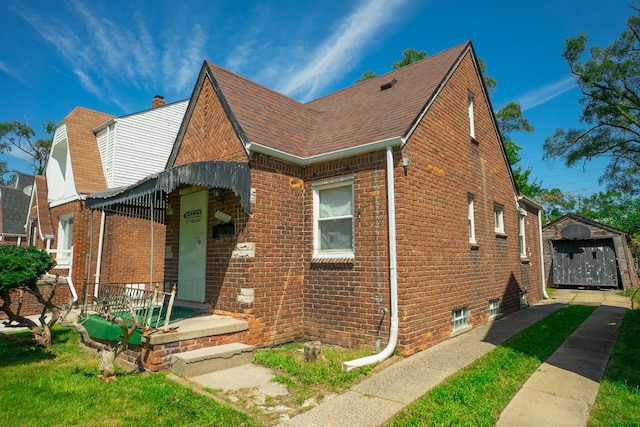 16226 Mark Twain St, Detroit, MI 48235 - view of front facade with brick siding and roof with shingles