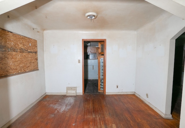 unfurnished room with hardwood / wood-style floors