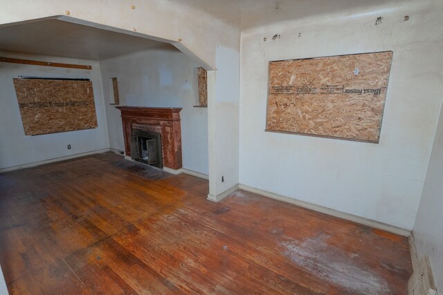 16226 Mark Twain St, Detroit, MI 48235 - unfurnished living room with wood finished floors, a fireplace with flush hearth, and baseboards