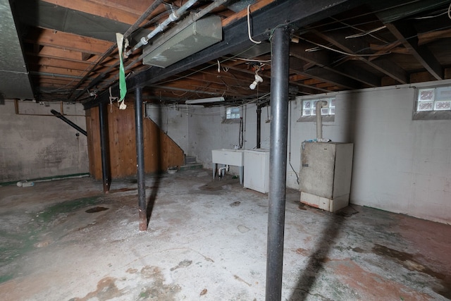 basement with sink and washer / dryer