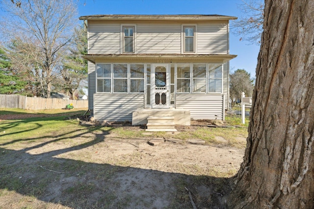 view of front of house with a sunroom