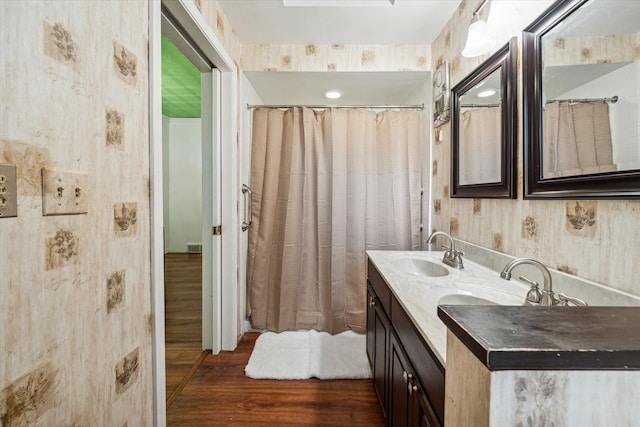 bathroom featuring wood-type flooring and vanity