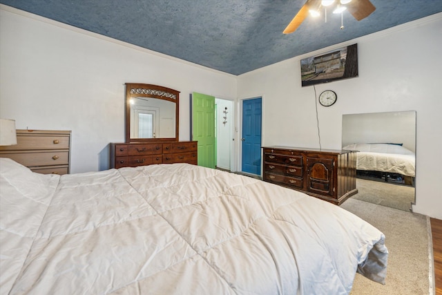 bedroom featuring ceiling fan, wood-type flooring, and ornamental molding