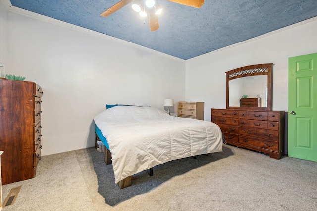 bedroom featuring ceiling fan, light colored carpet, and ornamental molding