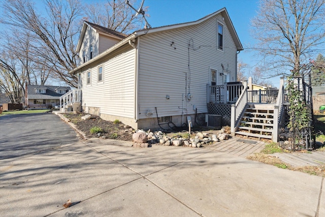 view of side of property with a deck