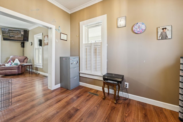 miscellaneous room with dark hardwood / wood-style flooring and ornamental molding