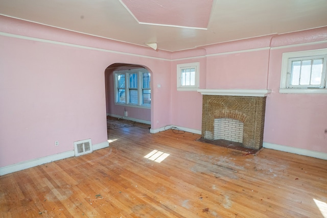 unfurnished living room featuring hardwood / wood-style flooring