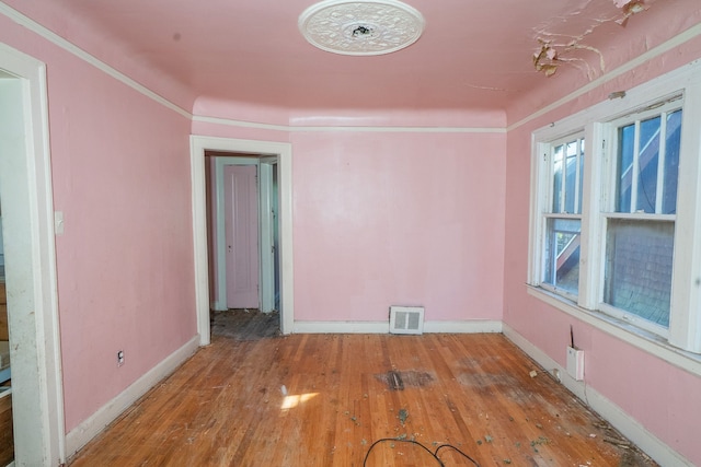 unfurnished room featuring hardwood / wood-style floors