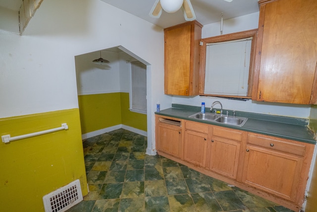 kitchen with ceiling fan and sink