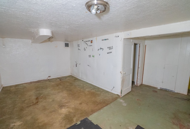 basement with a textured ceiling