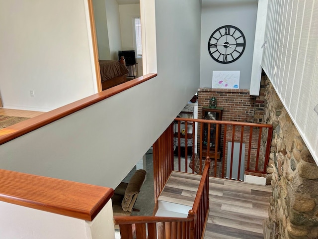 stairway featuring wood finished floors