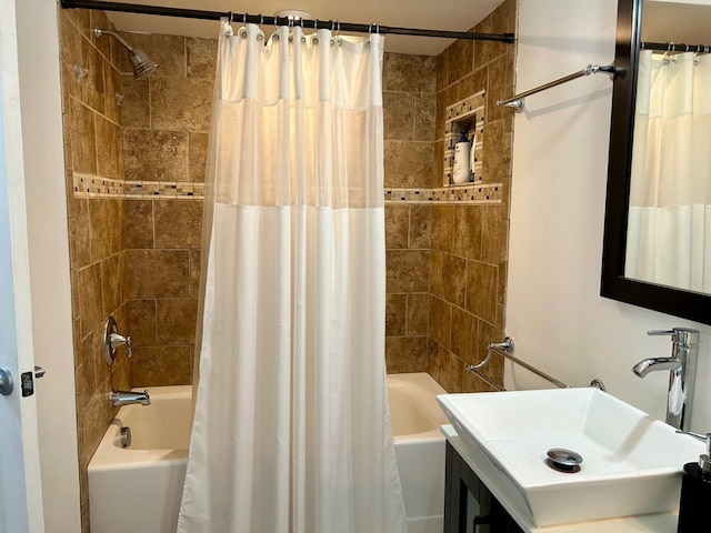 bathroom featuring shower / tub combo and vanity