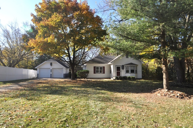 view of front facade featuring a front yard and a garage