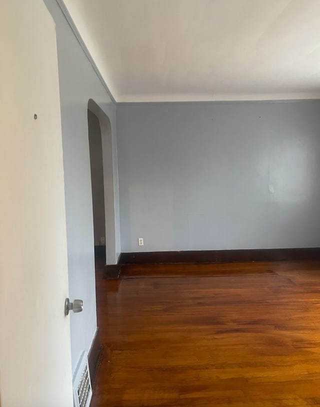 unfurnished room featuring dark hardwood / wood-style floors