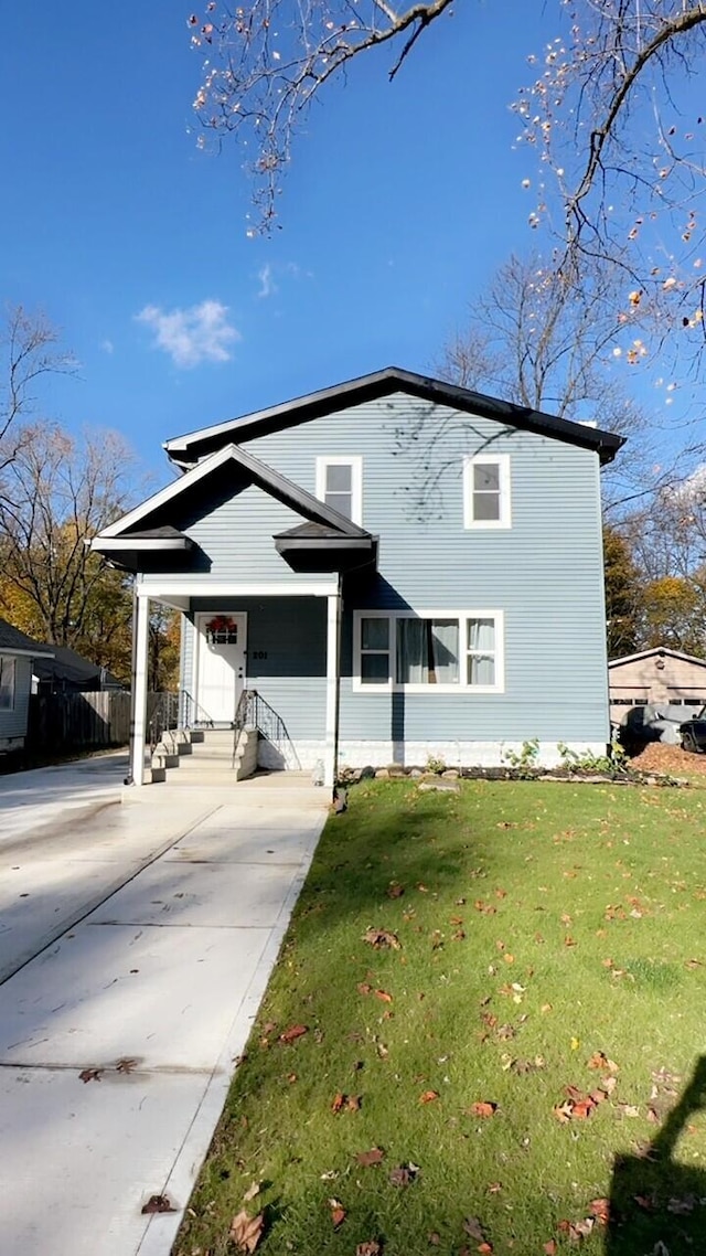 front facade with a front yard