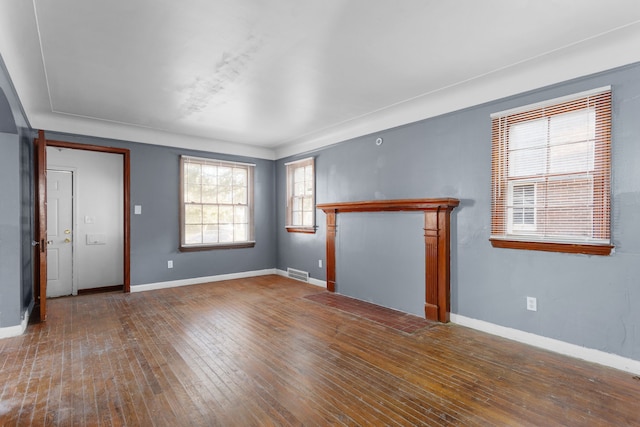 unfurnished living room featuring hardwood / wood-style flooring