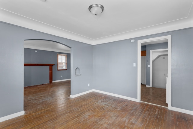 spare room featuring dark hardwood / wood-style floors