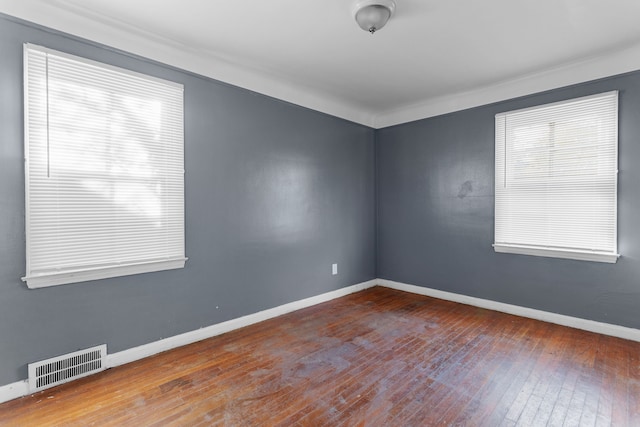 spare room featuring hardwood / wood-style flooring