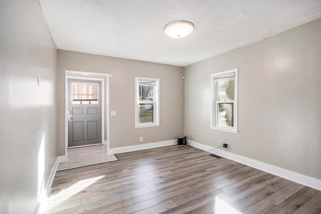 entryway with light hardwood / wood-style floors