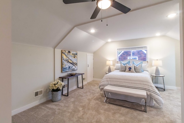 carpeted bedroom featuring ceiling fan and vaulted ceiling