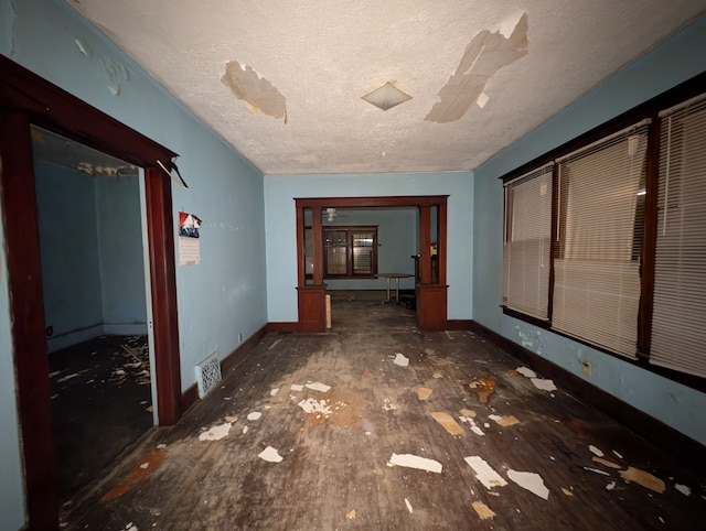 corridor featuring a textured ceiling