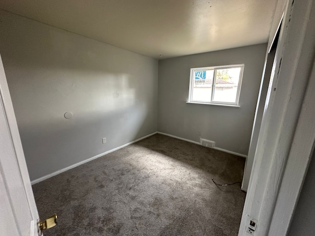 unfurnished room featuring carpet floors