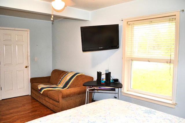 bedroom with dark wood-type flooring