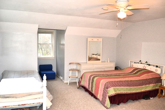 carpeted bedroom featuring vaulted ceiling and ceiling fan