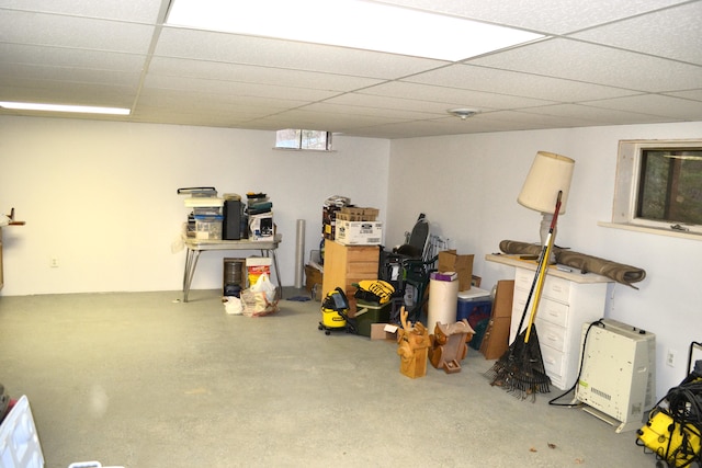 basement with a paneled ceiling