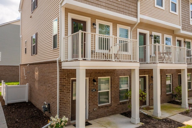 back of property featuring a balcony