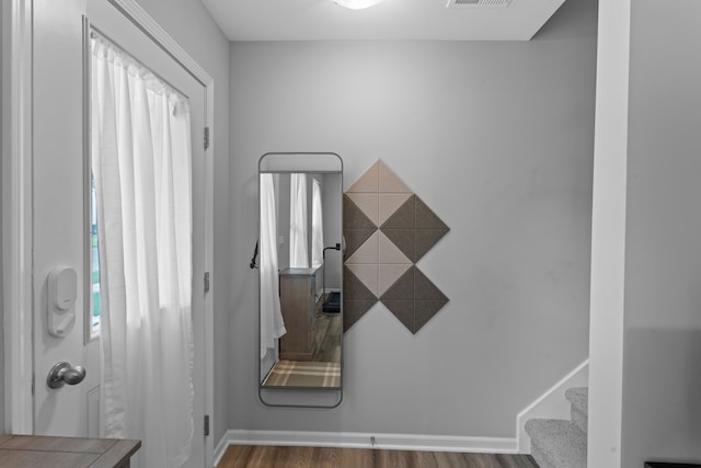 entrance foyer with dark hardwood / wood-style flooring