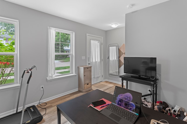 office with light wood-type flooring