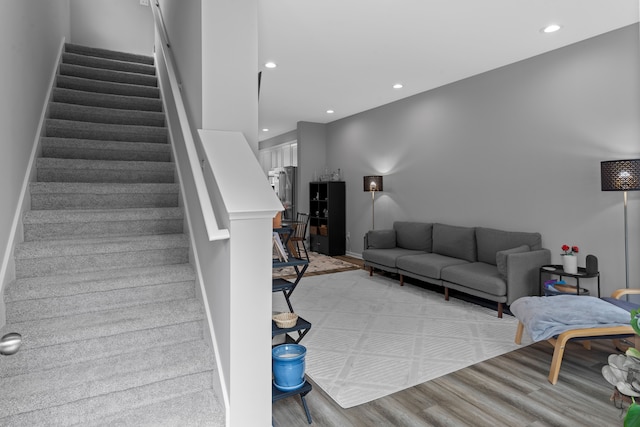 staircase featuring wood-type flooring