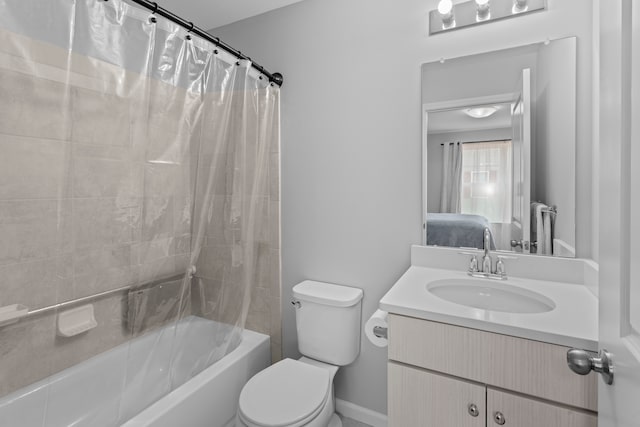 full bathroom featuring shower / tub combo with curtain, vanity, and toilet