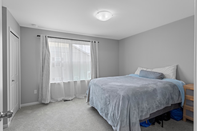 carpeted bedroom with a closet