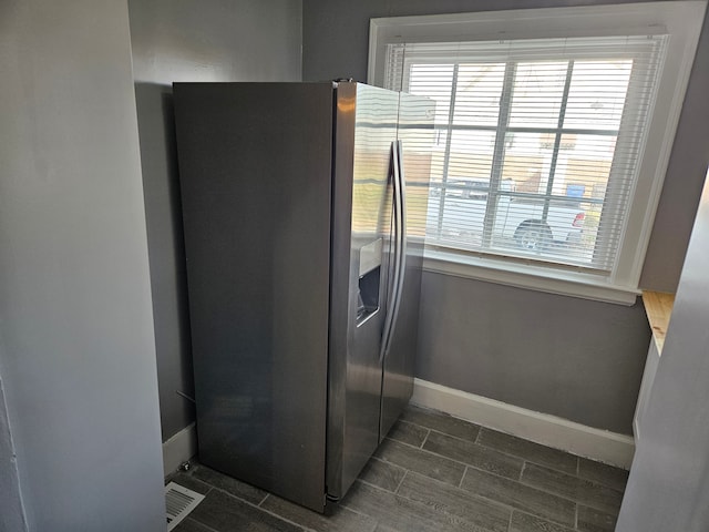 interior space featuring stainless steel fridge