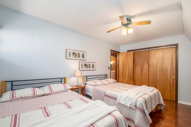 bedroom featuring ceiling fan, a closet, and dark hardwood / wood-style floors