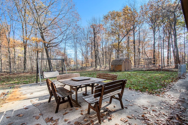 view of patio with a storage unit