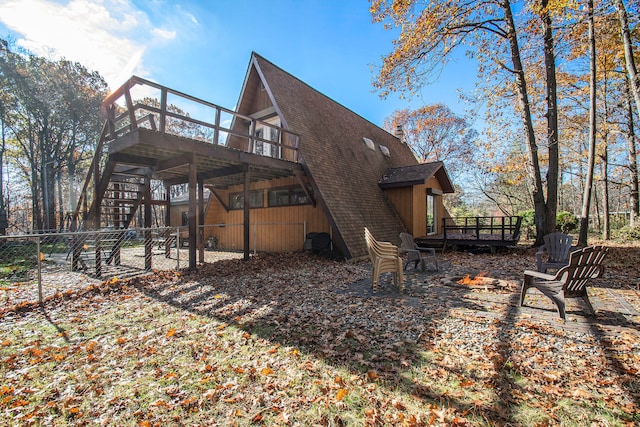 view of property exterior with a deck