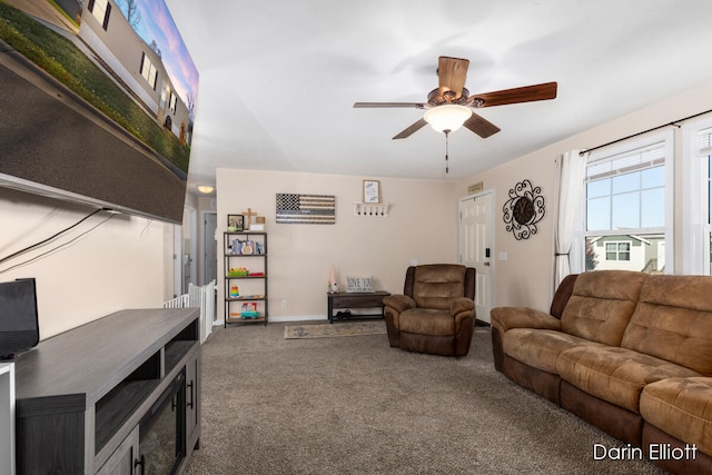 living room with ceiling fan and carpet floors